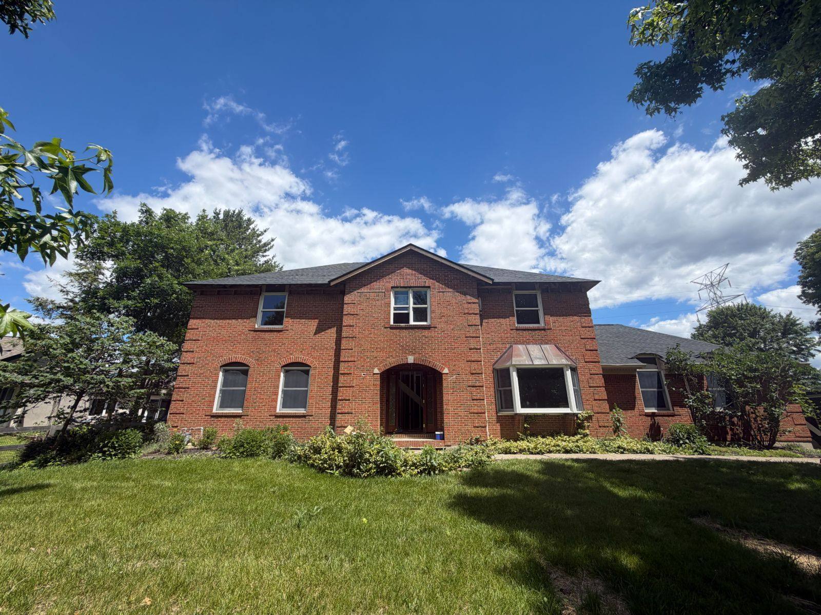 Restored brick two-story home by Resolute Construction and Remodel