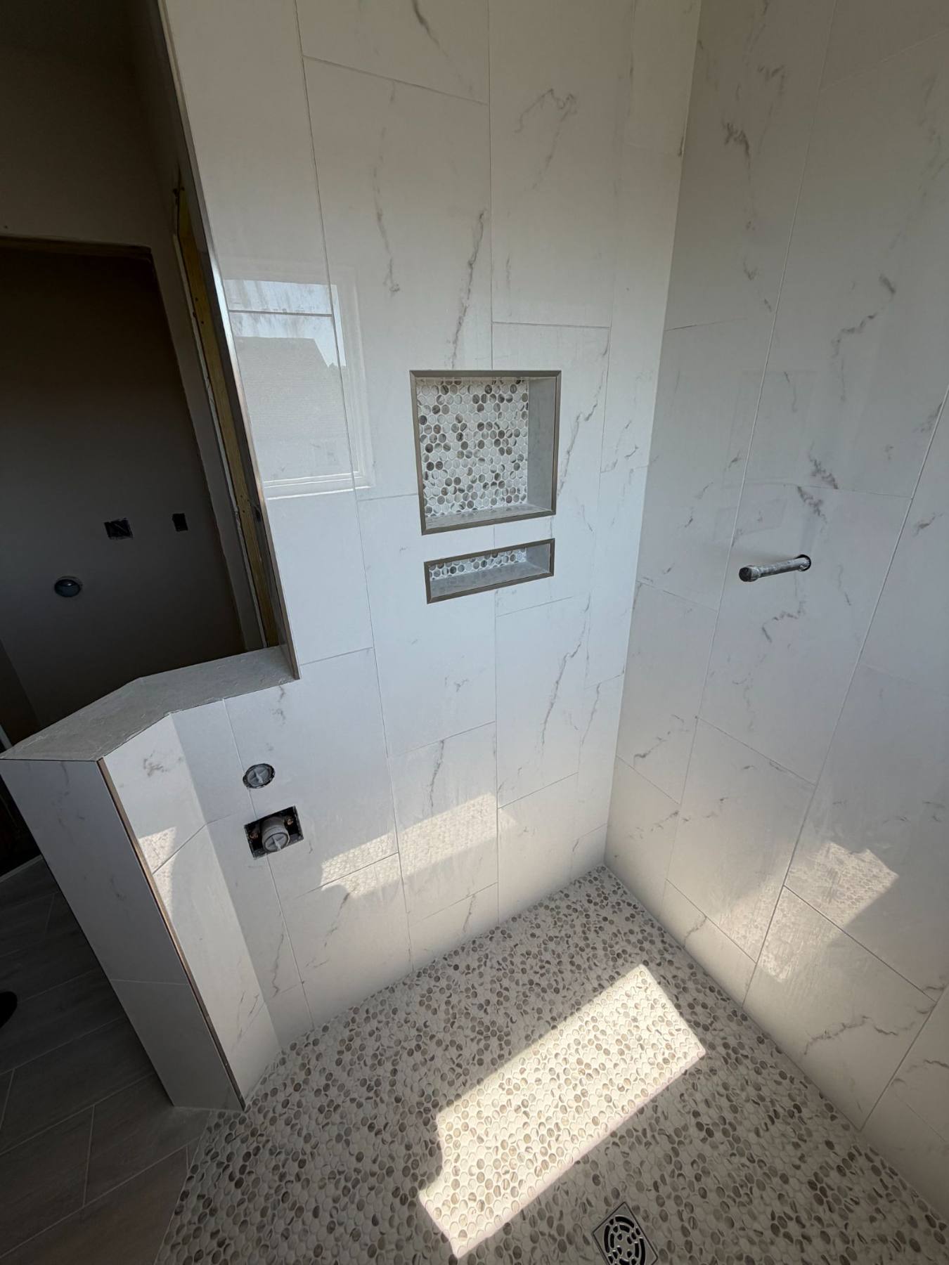 Custom recessed shower niches by Resolute Construction and Remodel