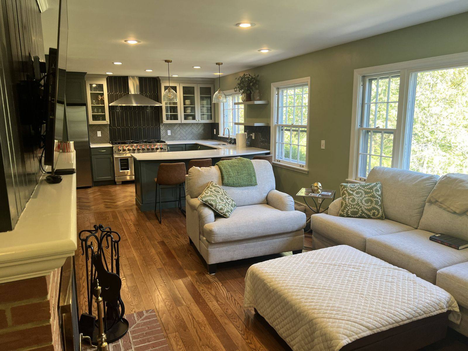 Open-concept kitchen and living remodel by Resolute Construction and Remodel