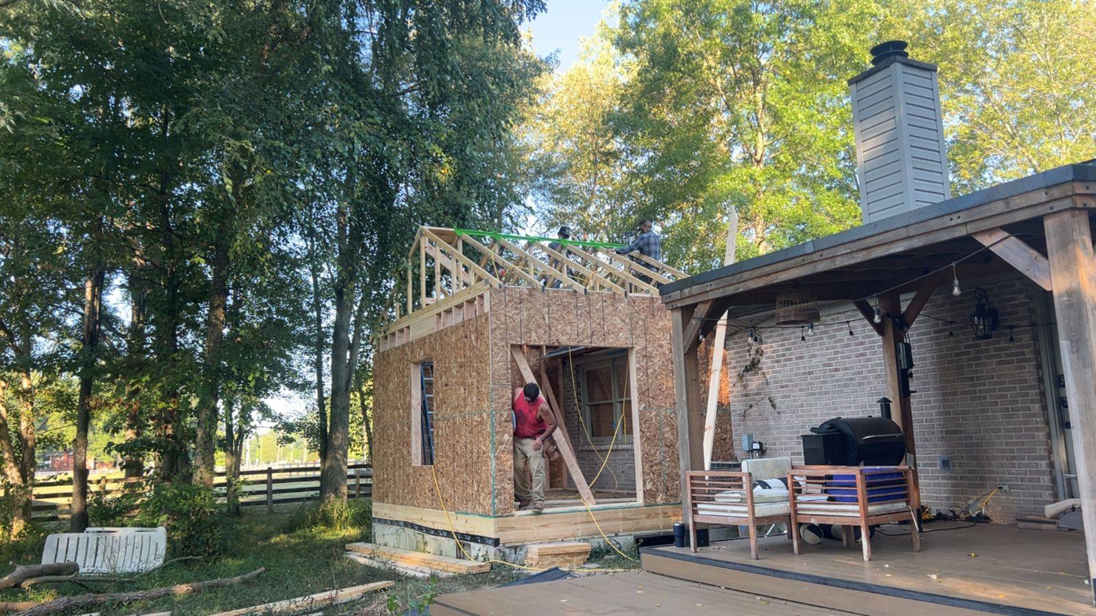 Resolute Construction and Remodel crew framing an addition on a job site