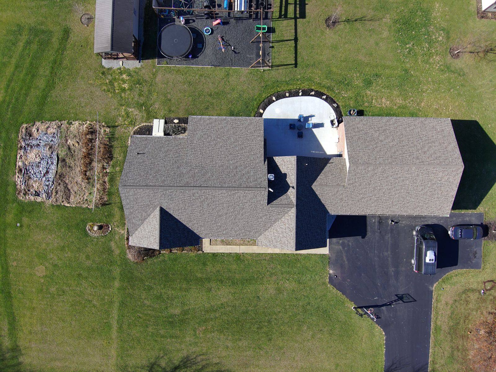 Full residential shingle roof, aerial view by Resolute Construction and Remodel